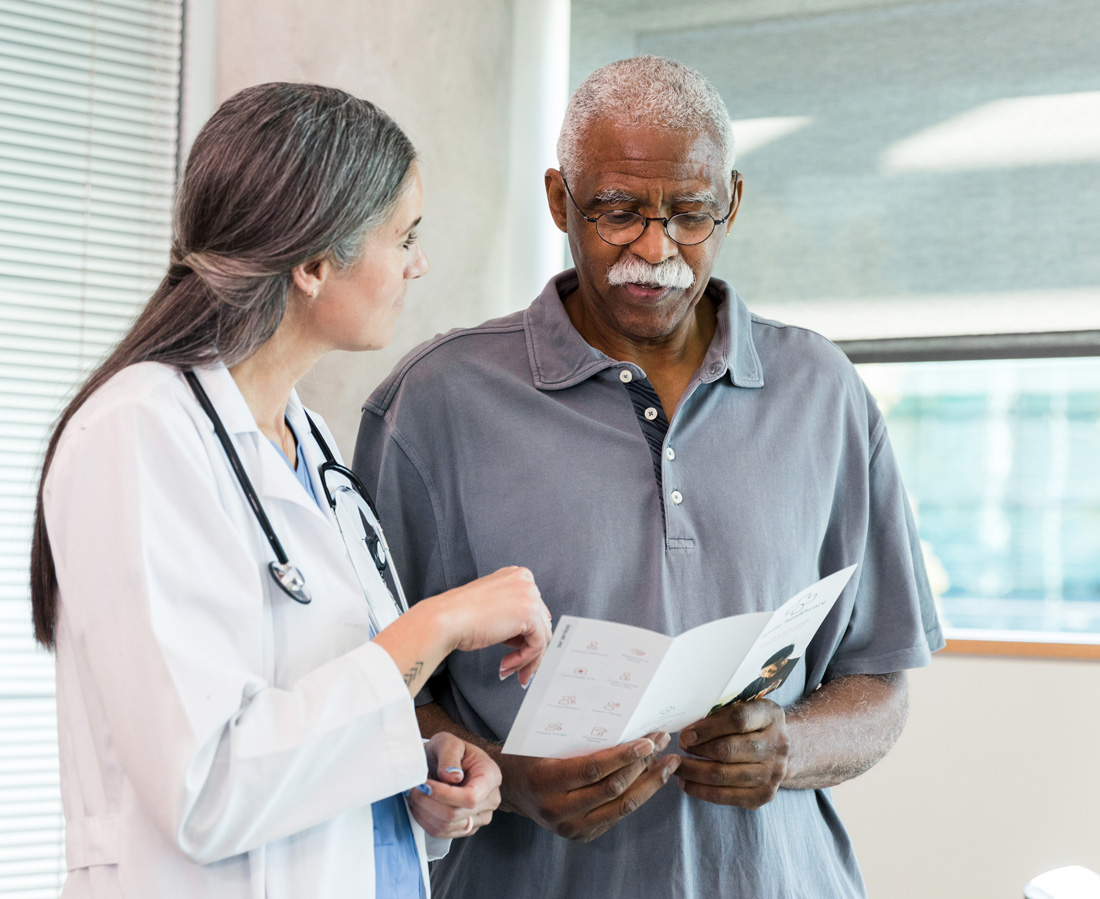 A doctor consulting with a patient about prostate cancer A doctor consulting with a patient about prostate cancer